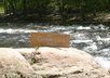 write your message on a sign by a swift river and take a high resolution photo small3