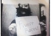 take a picture in the chuck e cheese photo booth in costume holding a sign displaying your message