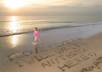 write your message in the sand on a tropical beach