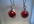 make a pair of red  pearl like earrings