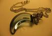 write a name on a grain of rice and place it in a blue crescent pendant necklace