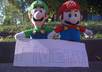 take a photo of the Mario Brothers in front of your logo, website or message small1