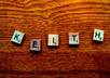 take a photo of any word or words using Scrabble tiles