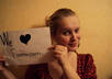 take a photo of me holding your website or business sign small1