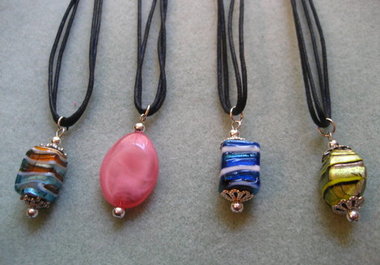 send you one beaded pendant on double strand black cord to US address only big1