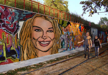 make 2 of your photos look like they were spray painted in graffiti on a wall big1