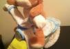 give instructions on how to create a diaper motorcycle for a baby shower