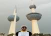 take a photo of your sign in front of Kuwait Towers