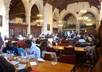 hand out flyers in the Yale University dinning hall